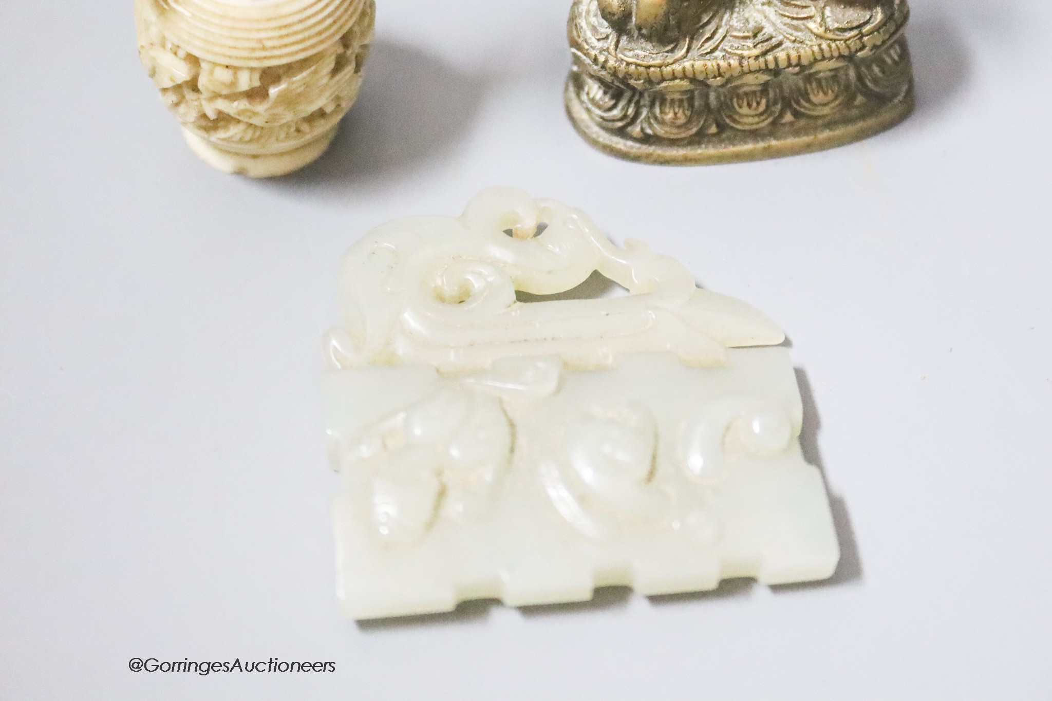 A coral and ivory miniature carving, height 9cm, a Buddha and a carved jade plaque